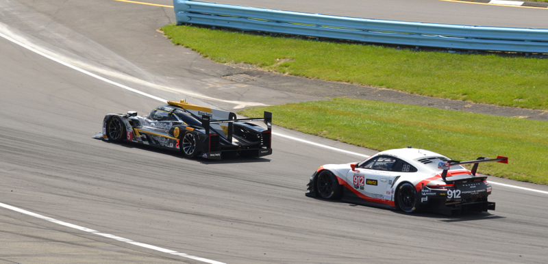 Mustang Sampling Racing Cadillac DPi leads the Porsche GT Team 911 GT RSR